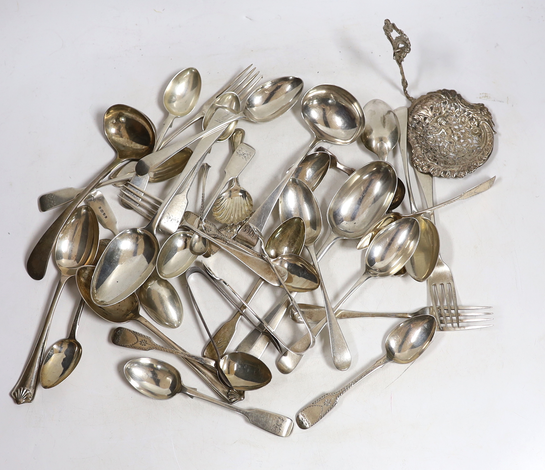 A quantity of assorted 19th century and later silver flatware, various patterns, dates and makers, including a set of silver bright cut engraved fiddle pattern teaspoons, 1843 and a Newcastle caddy spoon